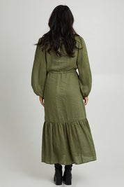 Model Katie wearing size S of the Nama Shirt Dress in colour Fern (Green), from the back