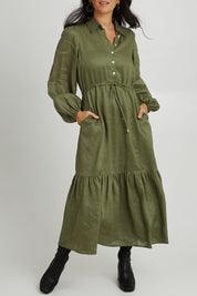 Model Katie wearing size S of the Nama Shirt Dress in colour Fern (Green), from the front, cropped image