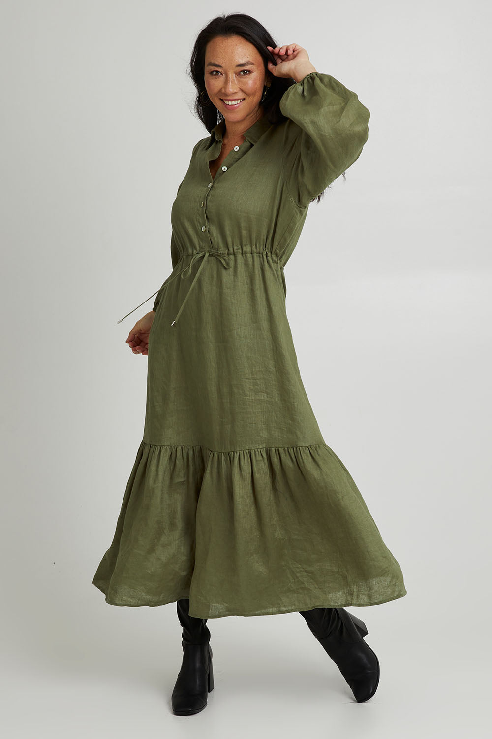 Model Katie wearing size S of the Nama Shirt Dress in colour Fern (Green), from the front, showing the whole outfit