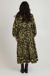 Model Katie wearing size S of the Mayan Tiered Maxi in colour Fern (Green), from the back