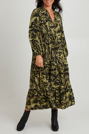 Model Katie wearing size S of the Mayan Tiered Maxi in colour Fern (Green), from the front, cropped image