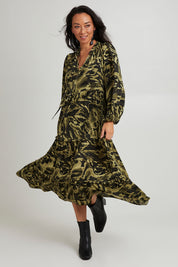 Model Katie wearing size S of the Mayan Tiered Maxi in colour Fern (Green), from the front, showing the whole outfit
