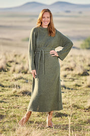 Model Katie wearing size OneSize of the Paarl Tie Knit Dress in colour Moss (Green), from the front, showing the whole outfit