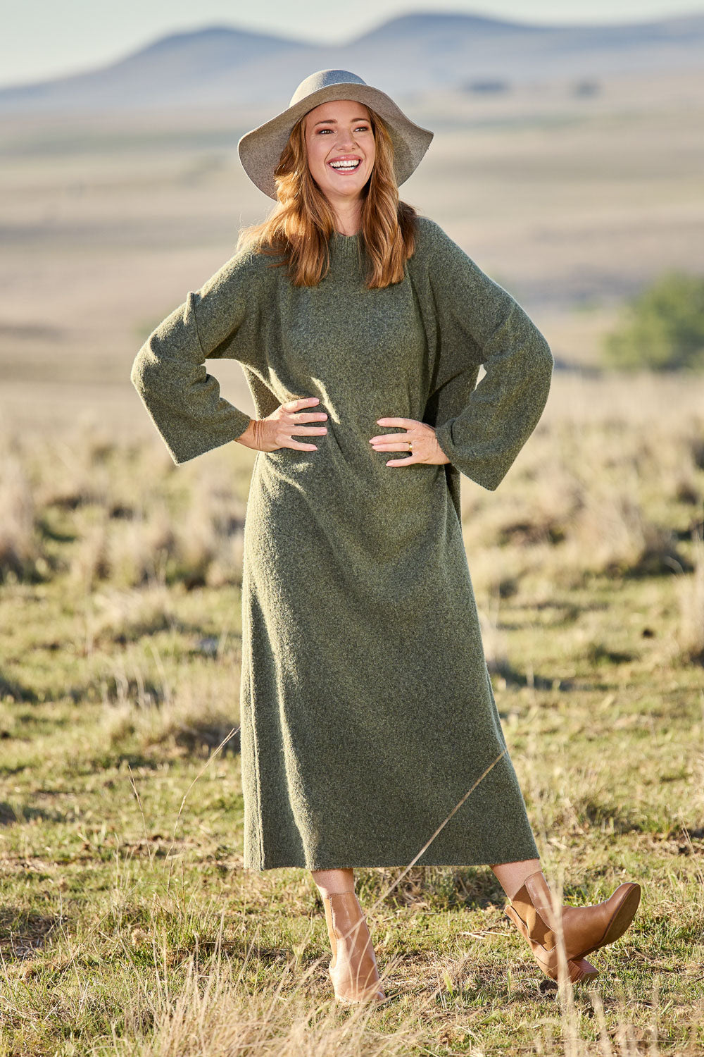Model Katie wearing size OneSize of the Paarl Tie Knit Dress in colour Moss (Green), from the front, showing the whole outfit