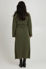 Model Katie wearing size OneSize of the Paarl Tie Knit Dress in colour Moss (Green), from the back
