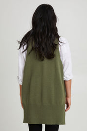 Model Katie wearing size S of the Nakako Vest in colour Moss (Green), from the back