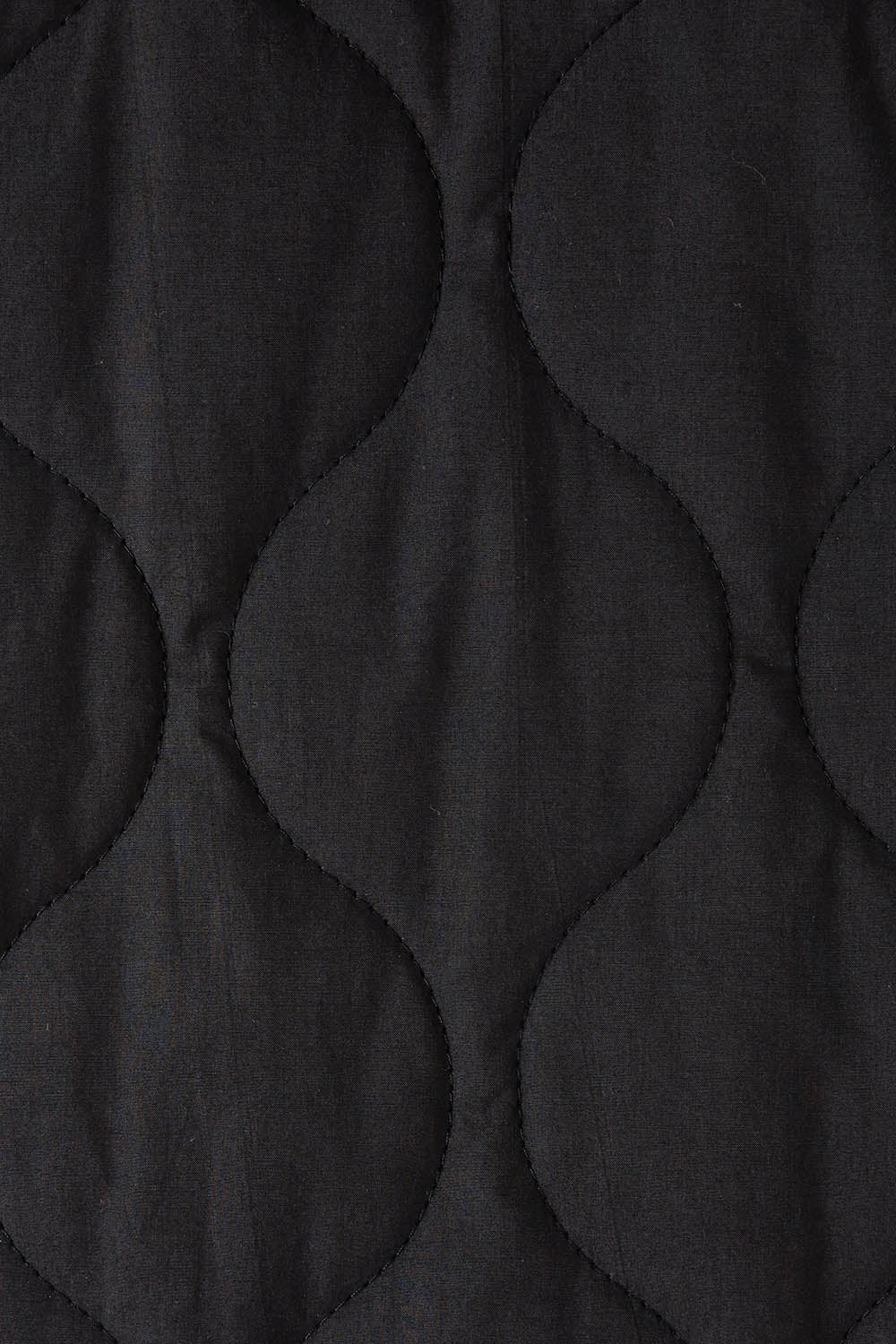 Product shot of the Ribe Vest in colour Ebony (Black), detail