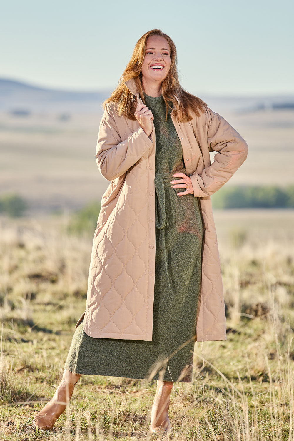 Model Katie wearing size S of the Ribe Coat in colour Putty, from the front, showing the whole outfit