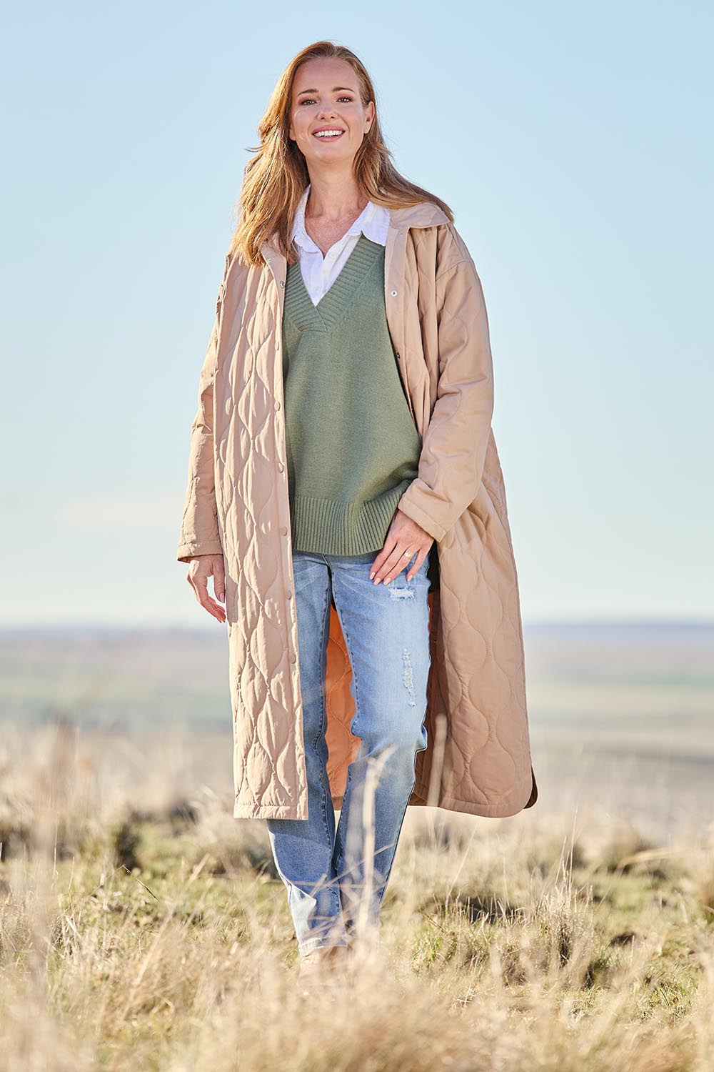 Model Katie wearing size S of the Ribe Coat in colour Putty, from the front, showing the whole outfit