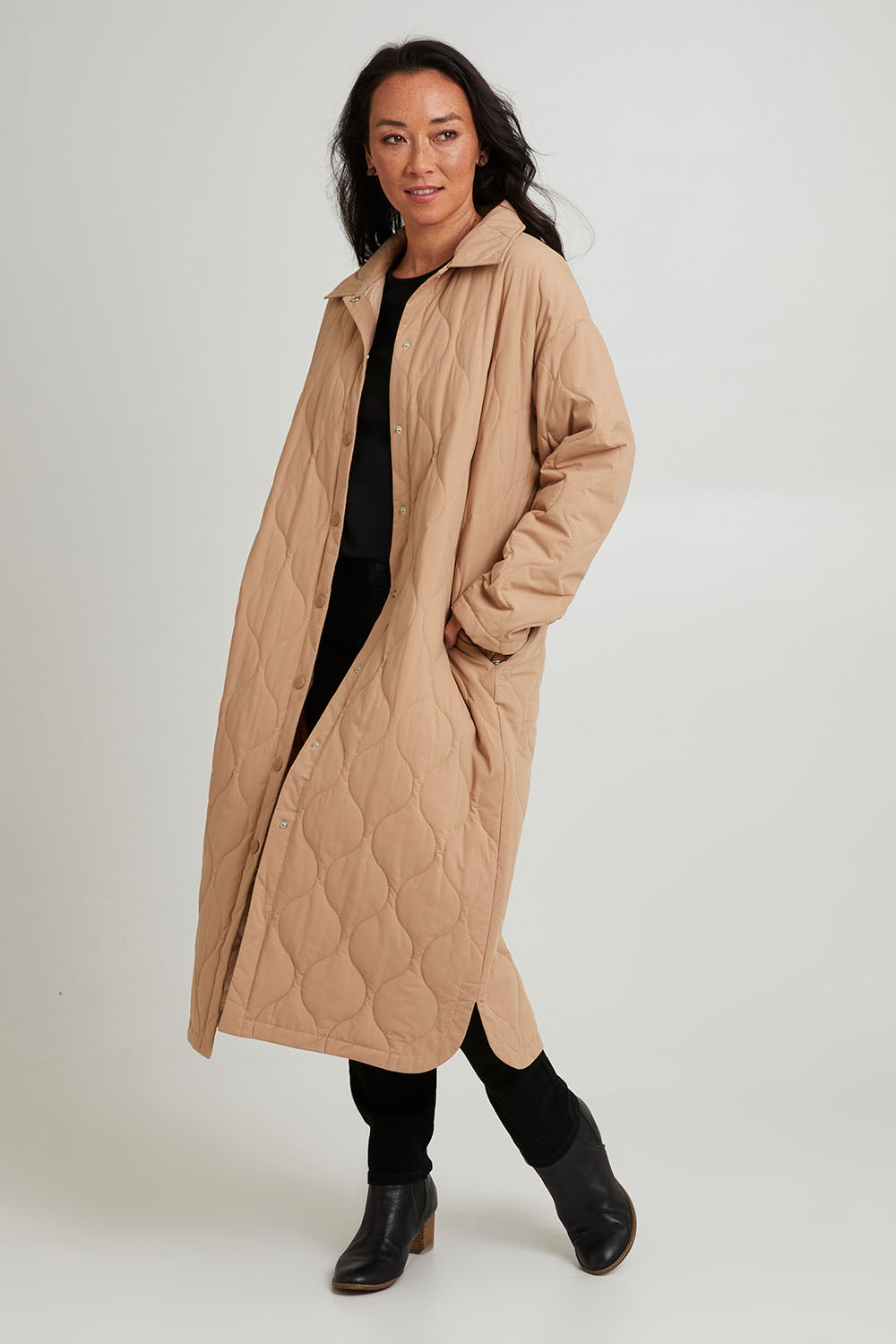 Model Katie wearing size S of the Ribe Coat in colour Putty, from the front, showing the whole outfit