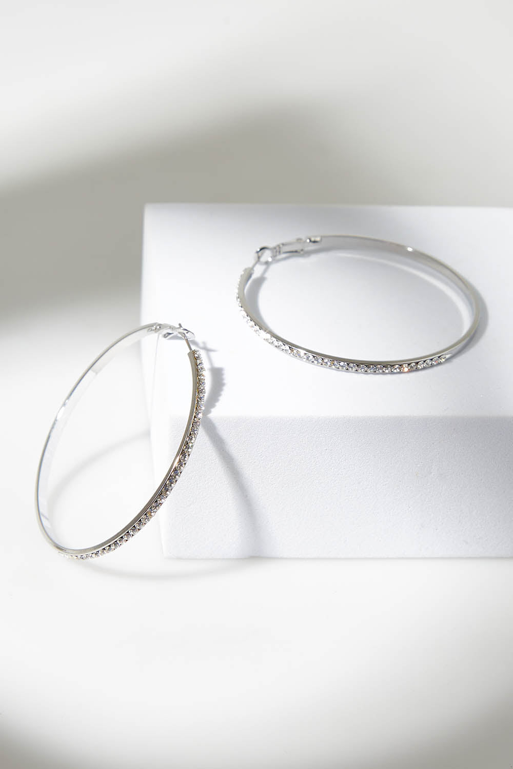 A model wearing the Norse Diamante Hoop in colour Silver (Metallics), from the front, showing the whole outfit