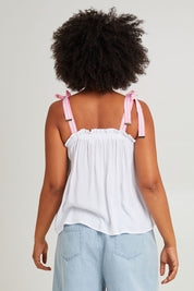 Model Olivia wearing size S of the La Mer Tie Tank in colour Opal (White), from the back