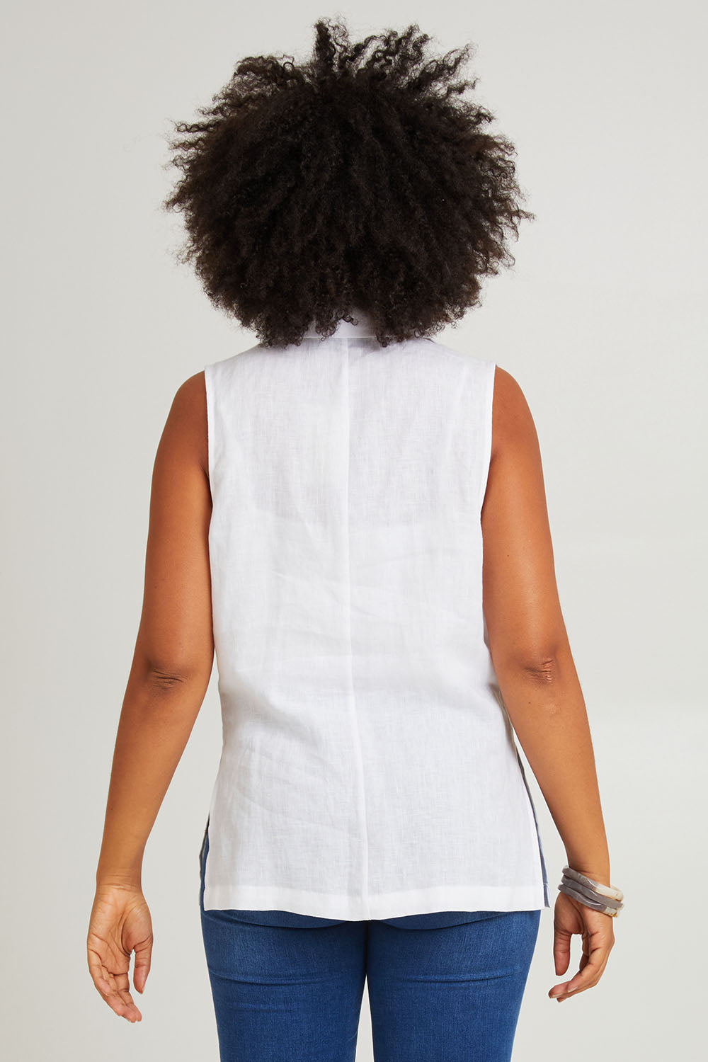 Model Olivia wearing size S of the Halcyon Linen Vest in colour Opal (White), from the back