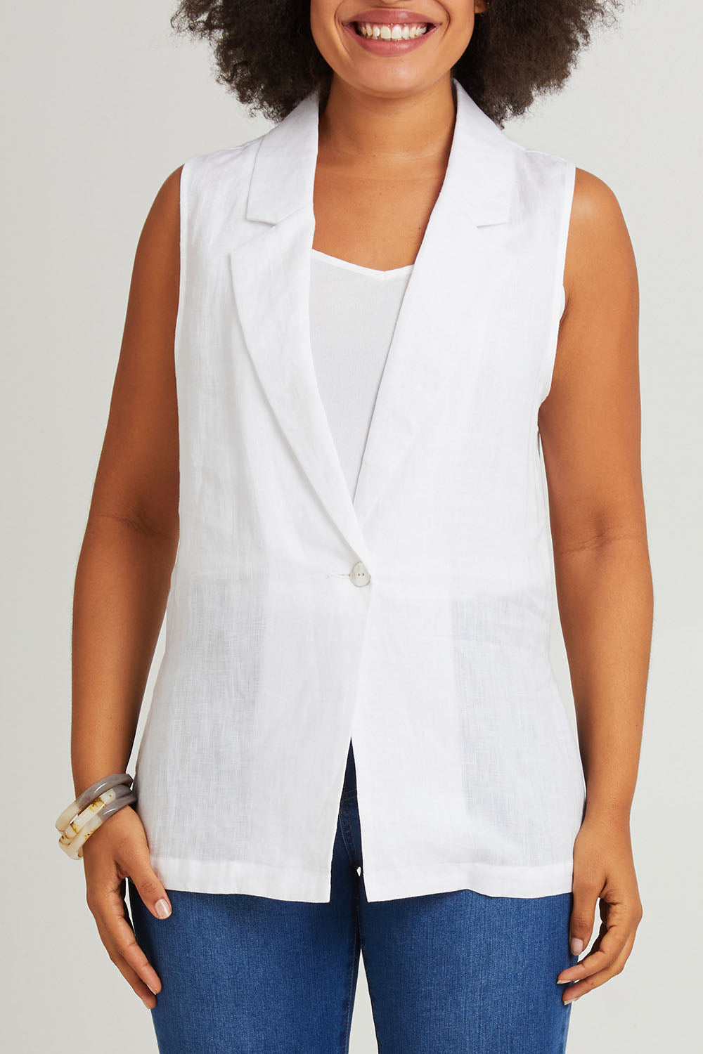 Model Olivia wearing size S of the Halcyon Linen Vest in colour Opal (White), from the front, cropped image
