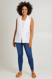 Model Olivia wearing size S of the Halcyon Linen Vest in colour Opal (White), from the front, showing the whole outfit