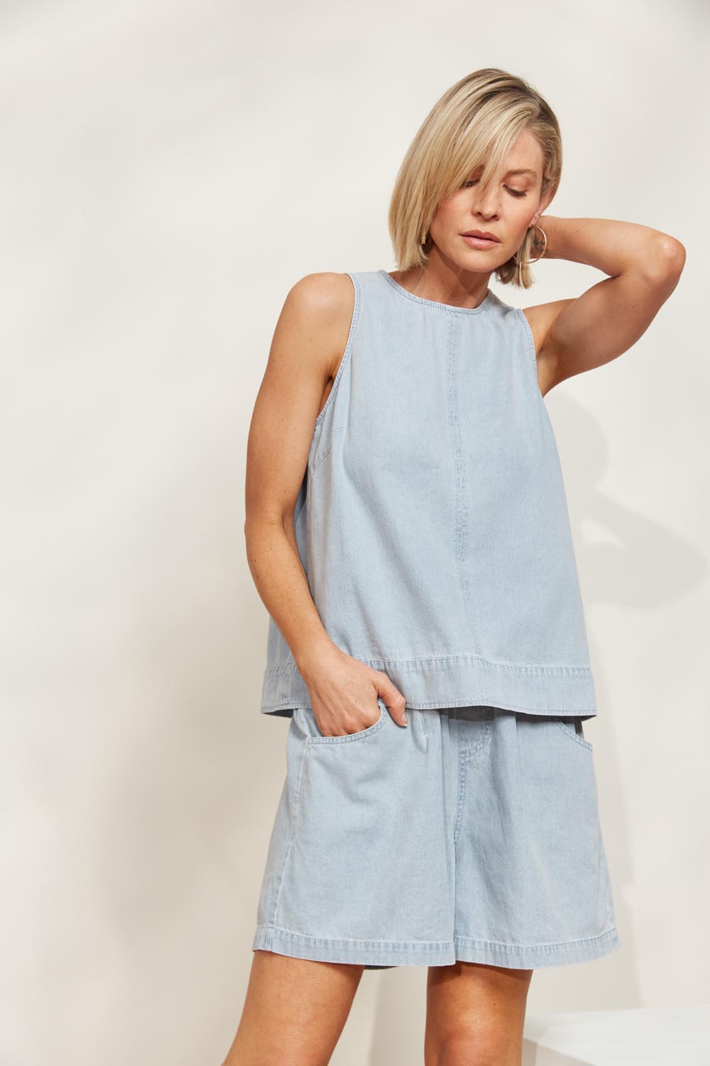A model wearing the Playa Cotton Short in colour Capri (Blue), from the front, showing the whole outfit