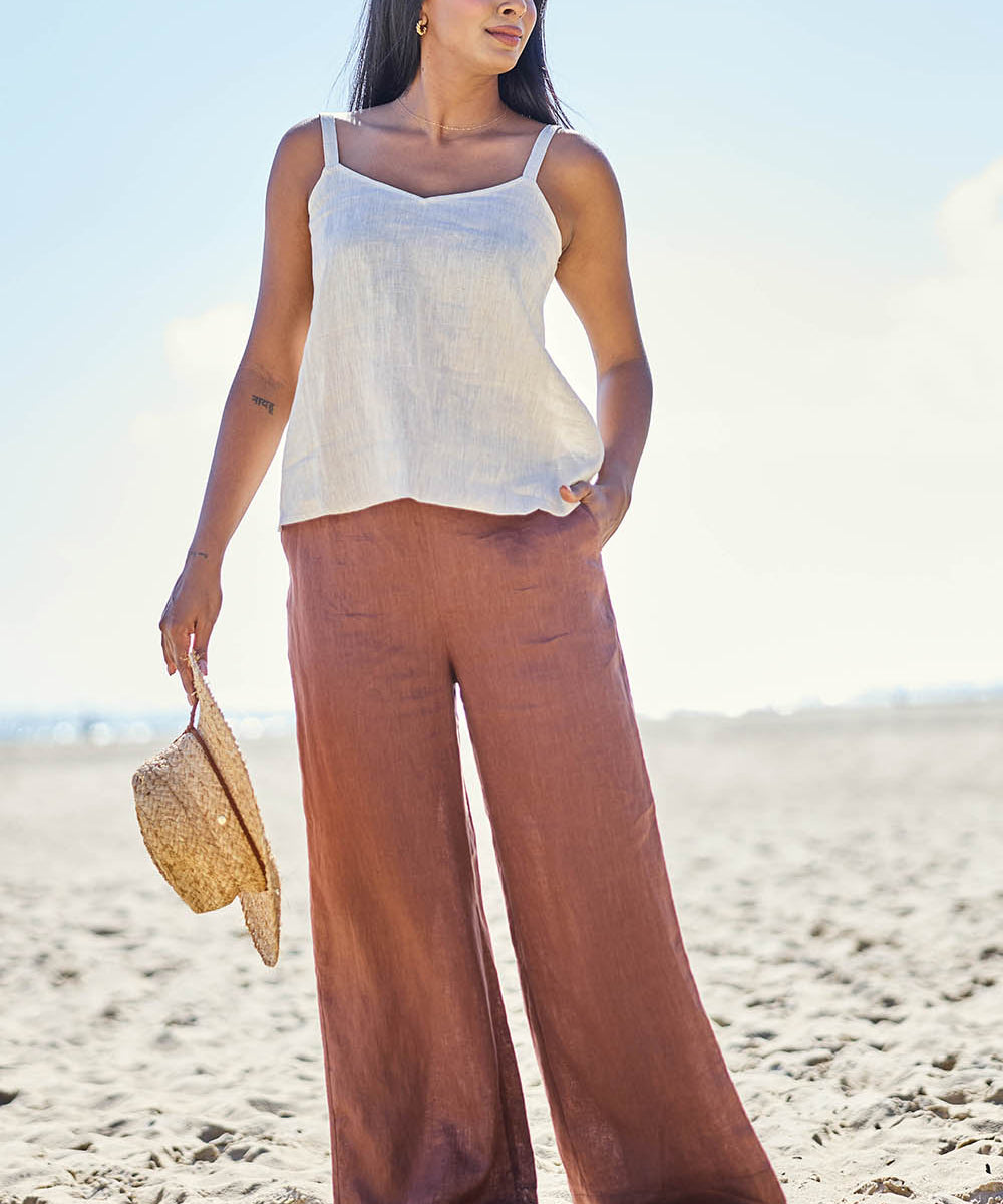 Model Eshan wearing size 10 of the Studio Linen Pant – Chocolate in colour Chocolate, from the front