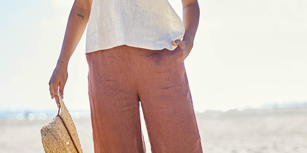 Model Eshan wearing size 10 of the Studio Linen Pant – Chocolate in colour Chocolate, from the front