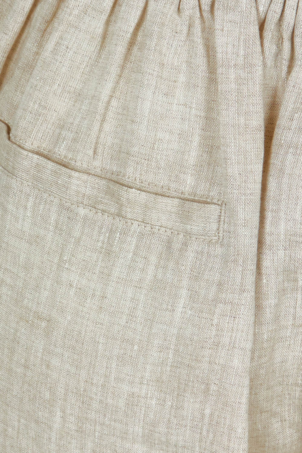 Product shot of the Studio Linen Pant in colour Tusk, detail