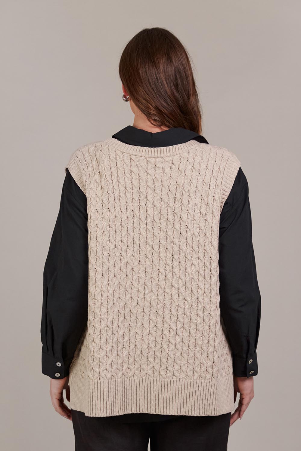 A model wearing the Naviva Cotton Vest in colour Oat, from the back