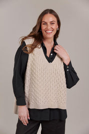 A model wearing the Naviva Cotton Vest in colour Oat, from the front, cropped image