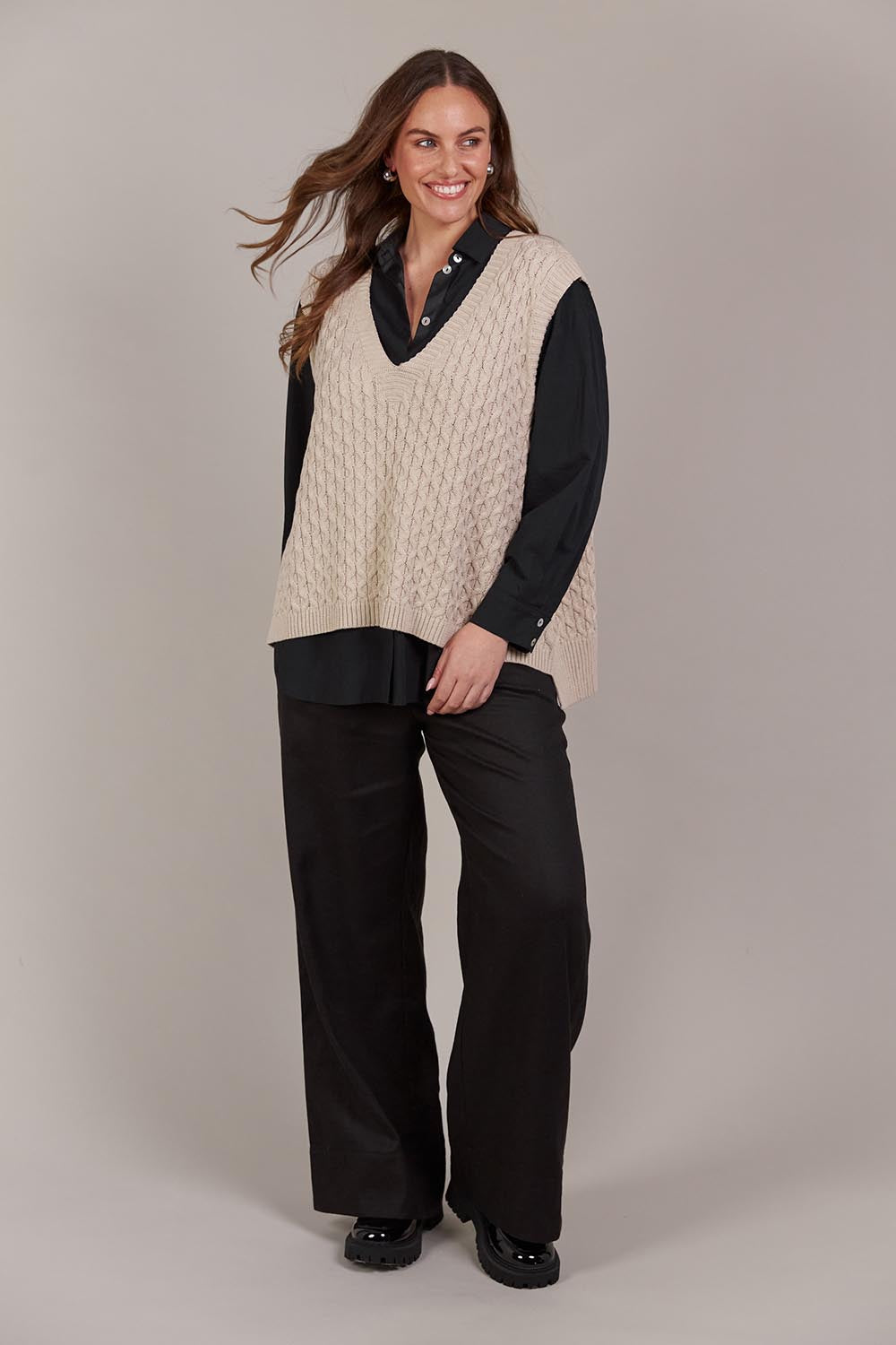 A model wearing the Naviva Cotton Vest in colour Oat, from the front, showing the whole outfit