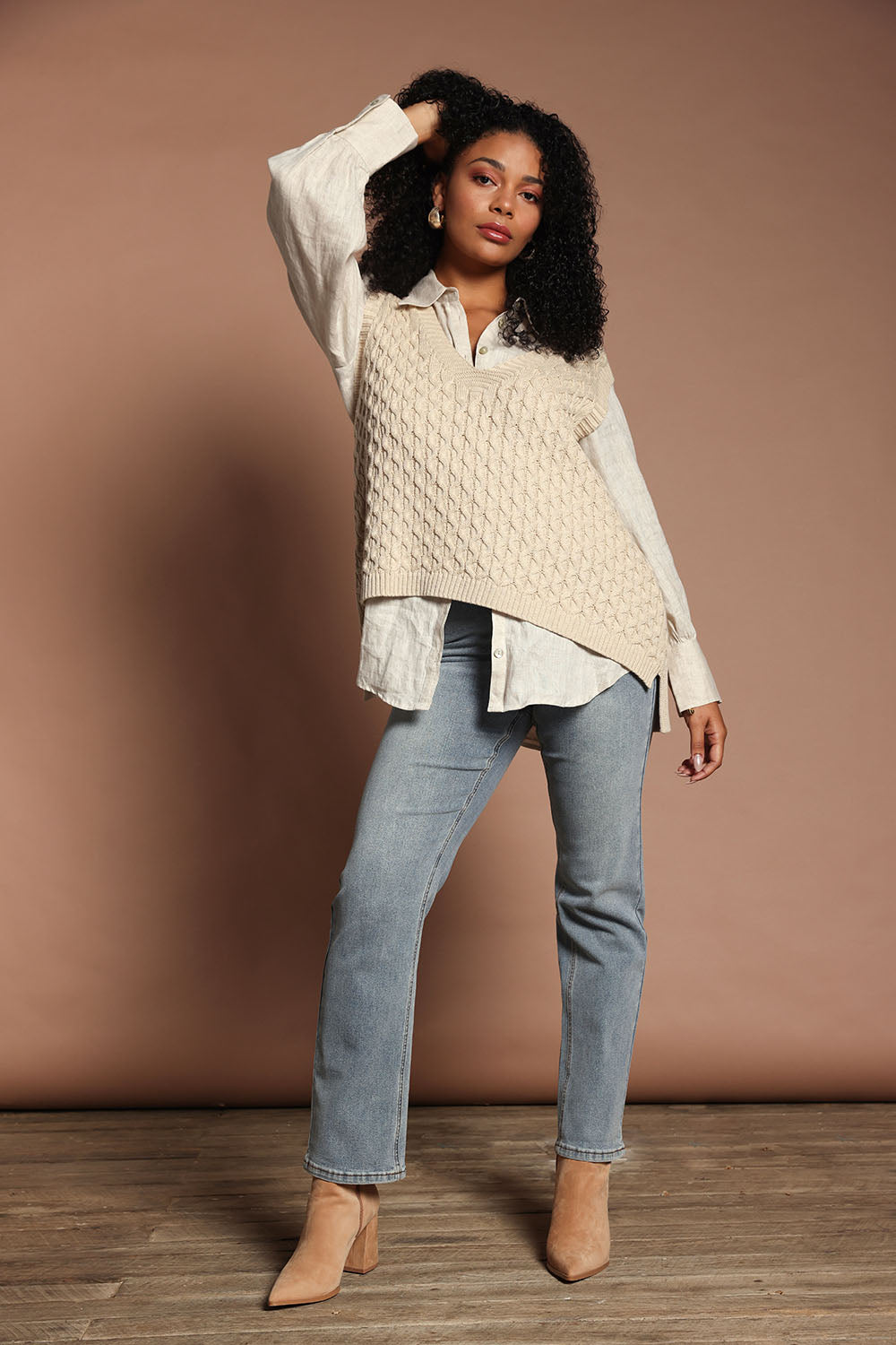 Model Ziara wearing the Naviva Cotton Vest in colour Oat, from the front, showing the whole outfit