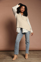 Model Ziara wearing the Naviva Cotton Vest in colour Oat, from the front, showing the whole outfit