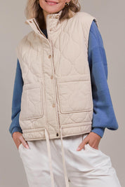 A model wearing the Pepi Cotton Vest in colour Ecru, from the front, cropped image
