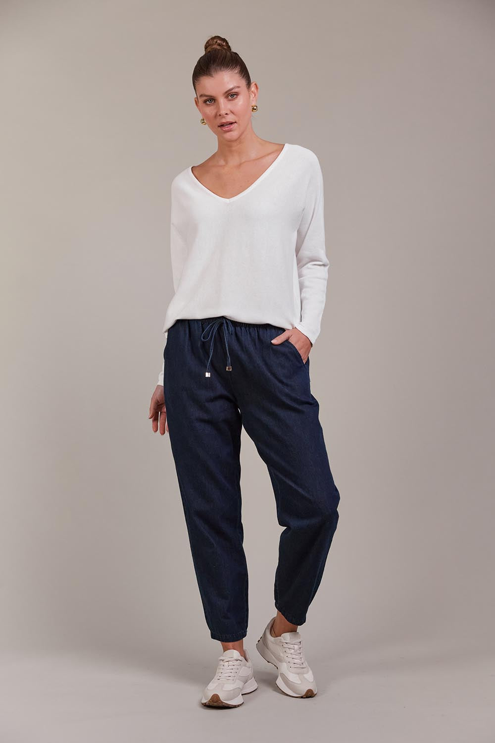 A model wearing the Pepi Relaxed Denim Pant in colour Oxford (Blue), from the front, showing the whole outfit