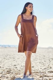 Model Eshan wearing size 10 of the Studio Linen Short Tank Dress – Chocolate in colour Chocolate, from the front