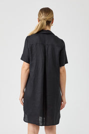 A model wearing the Studio Linen Short Shirt Dress in colour Black (Black), from the back