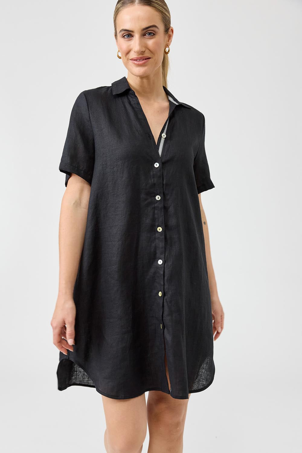 A model wearing the Studio Linen Short Shirt Dress in colour Black (Black), from the front, cropped image