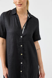A model wearing the Studio Linen Short Shirt Dress in colour Black (Black), from the front, cropped image
