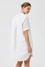 A model wearing the Studio Linen Short Shirt Dress in colour White (White), from the back