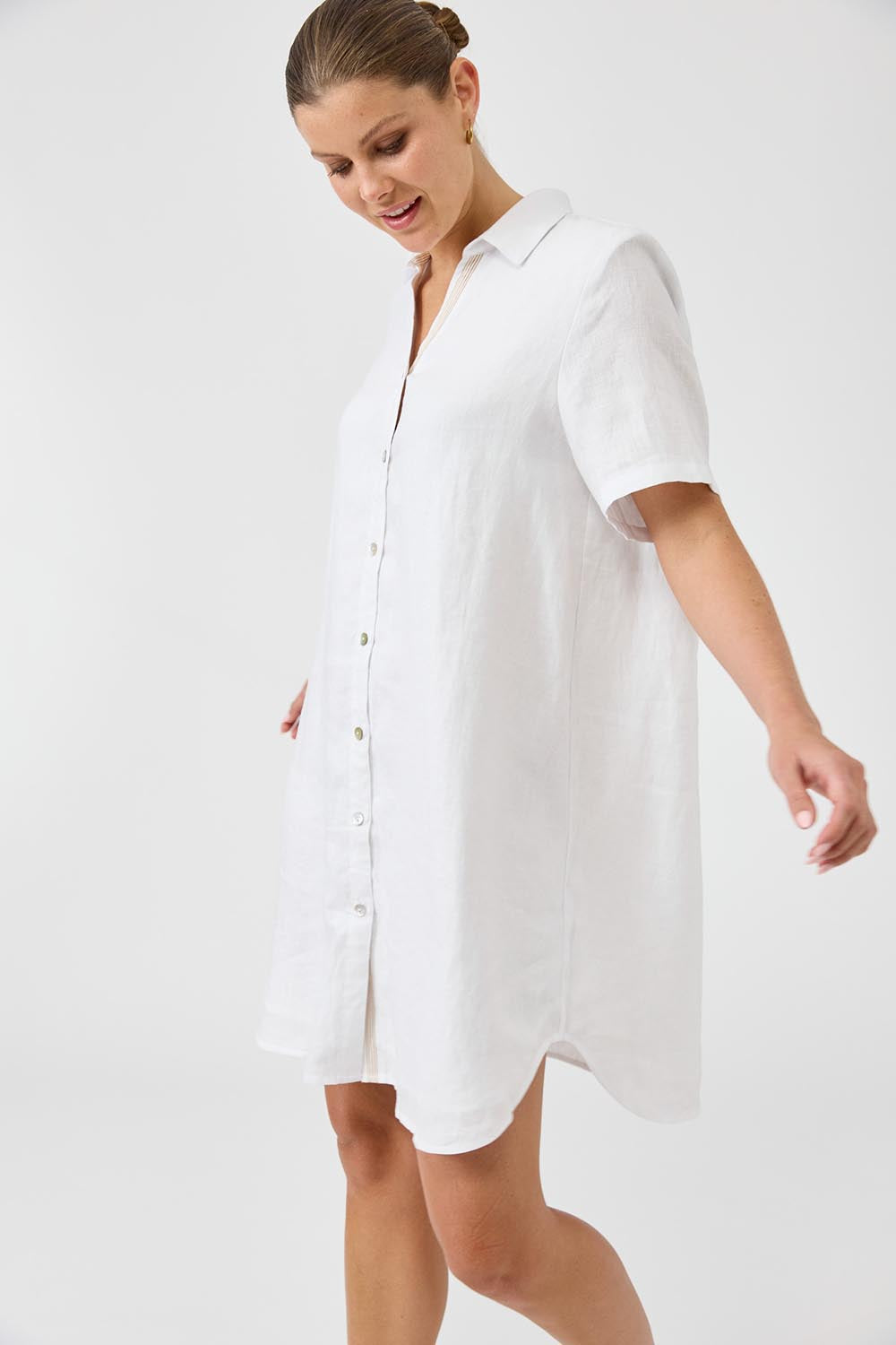 A model wearing the Studio Linen Short Shirt Dress in colour White (White), from the front, cropped image