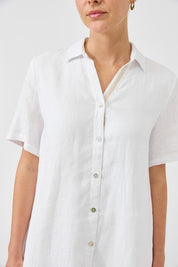 A model wearing the Studio Linen Short Shirt Dress in colour White (White), from the front, cropped image