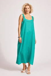 A model wearing the Miramar Linen Tank Maxi Dress in colour Lagoon (Green), from the front, showing the whole outfit