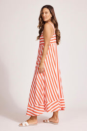 A model wearing the Treville Stripe Tank Maxi Dress in colour Coral (Red), from the front, showing the whole outfit