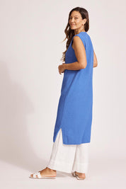 A model wearing the Artemis Cotton Knit Vest in colour Aegean (Blue), from the back