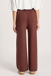 Model Genericm wearing size sample of the Samira Knit Pant - Mahogany in colour Mahogany, from the back