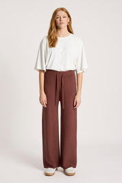 Model Genericm wearing size sample of the Samira Knit Pant - Mahogany in colour Mahogany, from the front