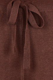 Product shot of the Samira Knit Pant - Mahogany in colour Mahogany, showing detail