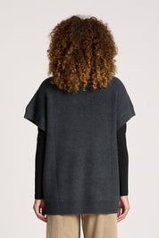 A model wearing the Berber Vest Cardigan in colour Charcoal (Black), from the back