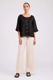 Model Genericm wearing size sample of the Studio Linen Button Top Jacket – Black in colour Black, from the front