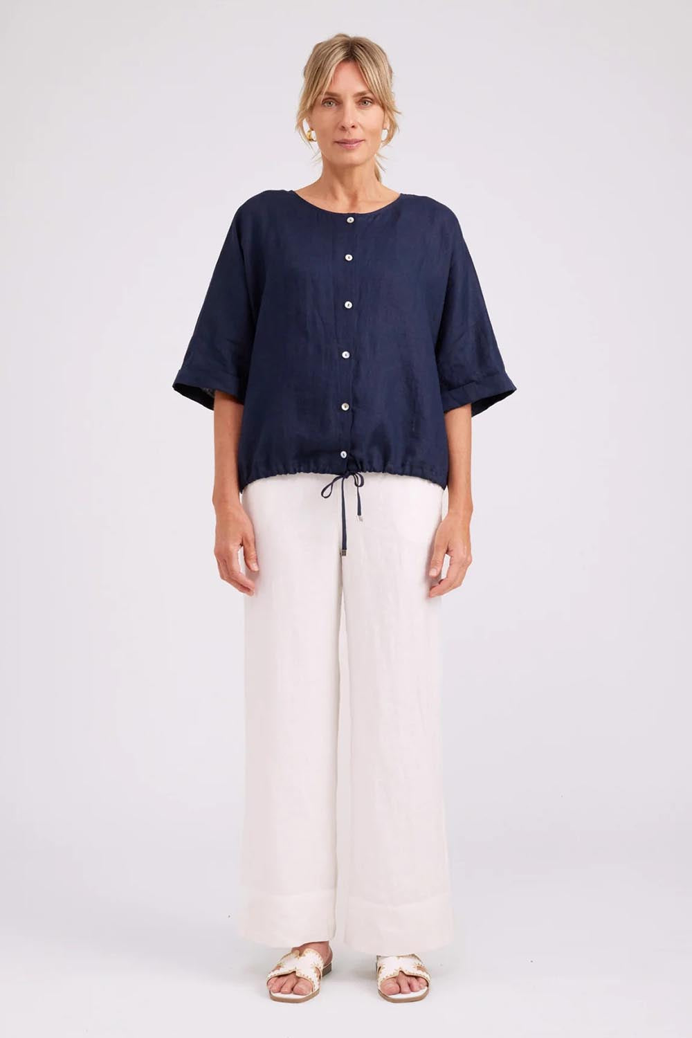 Model Genericm wearing size sample of the Studio Linen Button Top Jacket – Navy in colour Navy, from the front