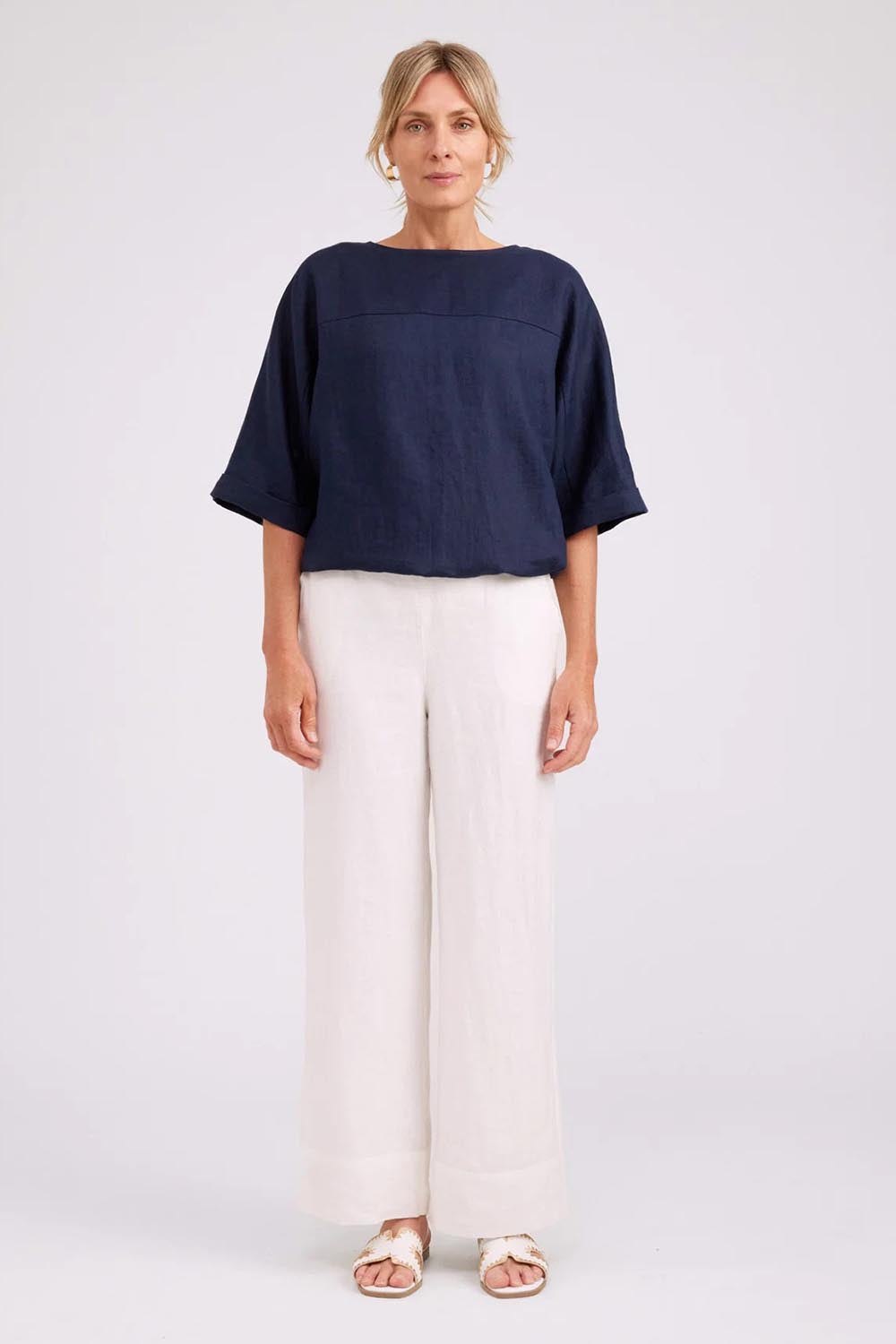 Model Genericm wearing size sample of the Studio Linen Button Top Jacket – Navy in colour Navy, from the front