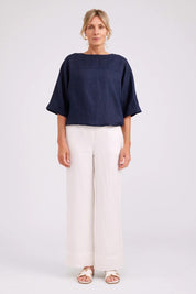 Model Genericm wearing size sample of the Studio Linen Button Top Jacket – Navy in colour Navy, from the front