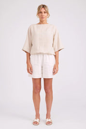 Model Genericm wearing size sample of the Studio Linen Button Top Jacket – Tusk in colour Tusk, from the front