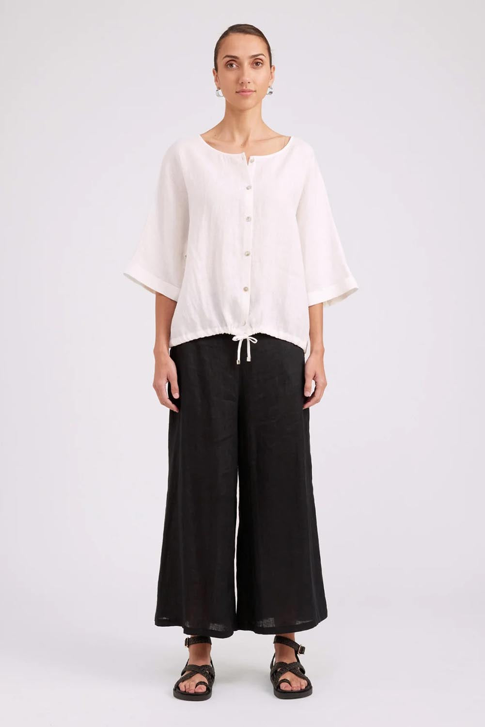 Model Genericm wearing size sample of the Studio Linen Button Top Jacket – White in colour White, from the front